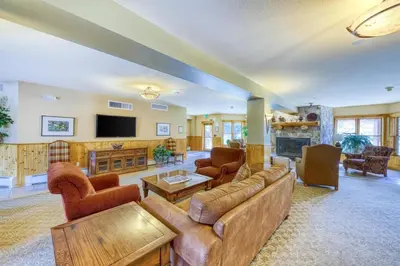 a large living room with a couch and a tv at Tenderfoot Lodge 2 Bedroom In Keystone in Keystone
