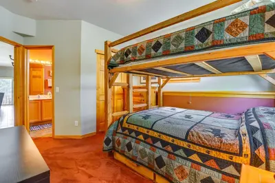 a bedroom with two bunk beds in a house at Cozy Condo with Views, 3 Mi to Winter Park Resort! in Winter Park