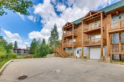 an apartment building with a large parking lot at Cozy Condo with Views, 3 Mi to Winter Park Resort! in Winter Park