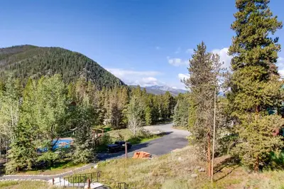 an aerial view of a parking lot in a forest at 1 Bedroom Mountain Condo In Lakeside Village Near Keystone Lake With Complimentary Shuttle Service in Keystone