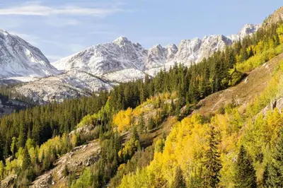 a mountain valley with trees and snow covered mountains at 1 Bedroom Mountain Condo In Lakeside Village Near Keystone Lake With Complimentary Shuttle Service in Keystone