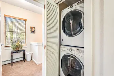 a laundry room with two washer and dryer at Luxury 3 Bedroom Townhouse Next To Keystone Lake, Free Shuttle, Hot Tub And Sauna in Keystone