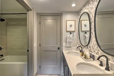 a bathroom with two sinks and a mirror at Hot Tub and Ski Shuttle Access Keystone Condo! in Keystone