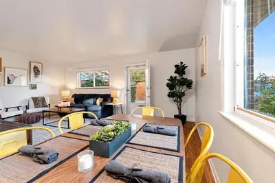 a living room with tables and chairs and a couch at Centrally Located Townhome Near PVH - Dog Friendly in Fort Collins