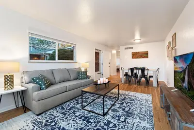 a living room with a couch and a table at Urban Oasis Near Old Town & PVH - Dog Friendly! in Fort Collins