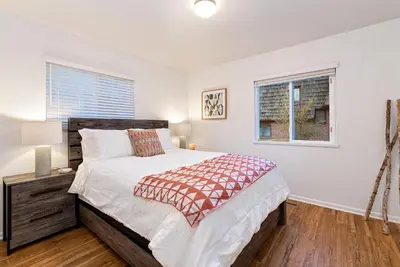 a bedroom with a large bed and a window at Urban Oasis Near Old Town & PVH - Dog Friendly! in Fort Collins