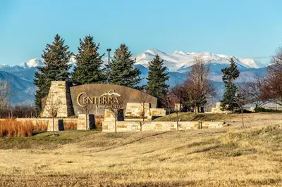 a building with a sign in the middle of a field at Comfortable Abode Near Historic Downtown in Loveland