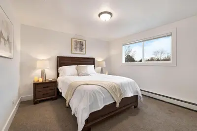 a bedroom with a large bed and a window at Comfortable Abode Near Historic Downtown in Loveland