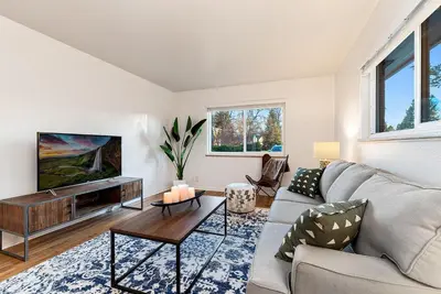 a living room with a couch and a tv at Stylish Getaway with Designer Touches - Free Bikes in Fort Collins