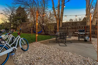 a group of bikes parked in a yard with a grill at Stylish Getaway with Designer Touches - Free Bikes in Fort Collins