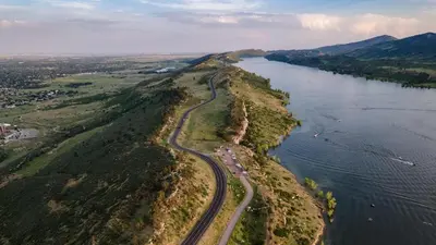 an aerial view of a road on an island in the water at Hidden Gem Near Old Town - Grill & Cruiser Bikes! in Fort Collins
