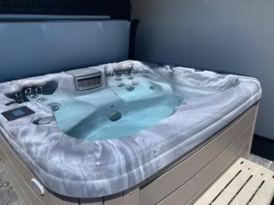 a jacuzzi tub with a heater on top of it at Relaxing in Paradise with Private Rooftop Deck! in Fort Collins