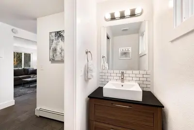 a bathroom with a sink and a mirror at Comfortable Home - Close to Rocky Mtn National Park in Loveland