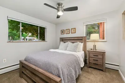 a bedroom with a bed and a window at Contemporary condo in the heart of Old Town in Fort Collins