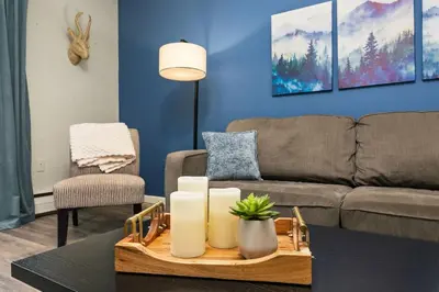 a living room with a couch and a table at Stylish Condo in the Heart of Old Town in Fort Collins
