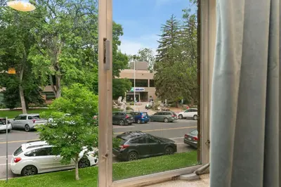 a view of a parking lot through a window at Stylish Condo in the Heart of Old Town in Fort Collins