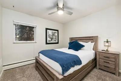 a bedroom with a large bed and a window at Stylish Condo in the Heart of Old Town in Fort Collins