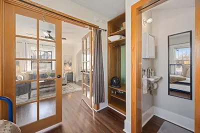 a hallway with a door leading to a bathroom at Newly Renovated in the Heart of Historic Loveland in Loveland