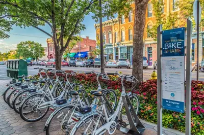 a row of bikes parked next to a street at Elegant Loft-Style Retreat in Old Firehouse Alley in Fort Collins