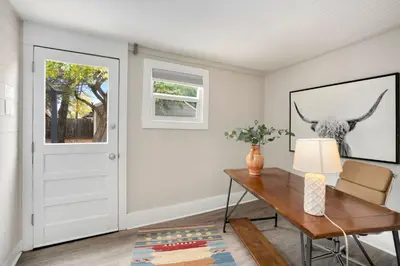 a home office with a desk and a window at Charming Old Town Bungalow with Free Cruiser Bikes in Fort Collins
