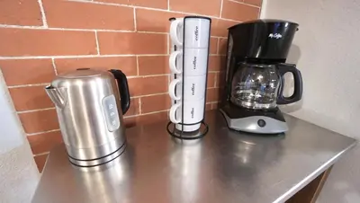 a counter with a coffee maker and a blender at Gorgeous Guest Suite - Walk to Old Town and CSU! in Fort Collins