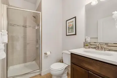 a bathroom with a shower and a toilet and a sink at Modern Townhome Steps from the Brewery District! in Fort Collins