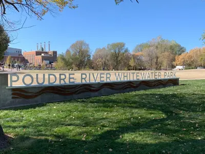 a sign for arouge river withwater play in a park at Modern Townhome Steps from the Brewery District! in Fort Collins