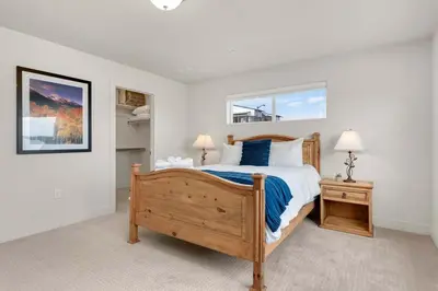 a bedroom with a large bed and two night stands at Modern Townhome Steps from the Brewery District! in Fort Collins