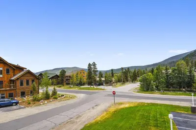 an empty street in a town with a mountain at Cedar Lodge 221 condo in Frisco