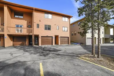 an empty parking lot in front of a building at Lagoon 736D townhouse in Frisco