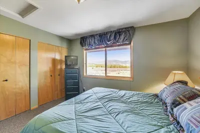 a bedroom with a bed and a window at Lagoon 736D townhouse in Frisco