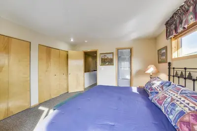 a bedroom with a large purple bed in a room at Lagoon 736D townhouse in Frisco