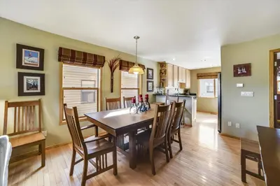 a kitchen and dining room with a table and chairs at Lagoon 736D townhouse in Frisco