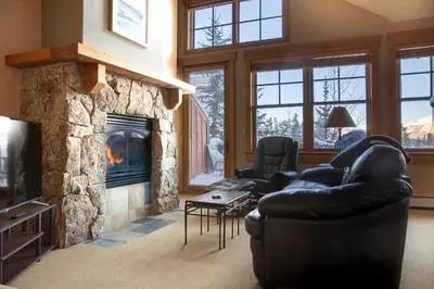 a living room with a couch and a fireplace at 3 Mi to Keystone Resort Condo with Mountain View in Keystone