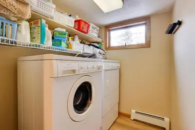 a washing machine in a laundry room with a window at Deck and Mtn View Keystone Townhome Near Resort! in Keystone