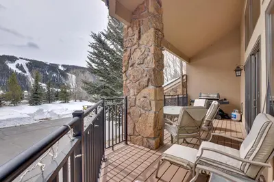 a balcony with chairs and a table with a view at Deck and Mtn View Keystone Townhome Near Resort! in Keystone