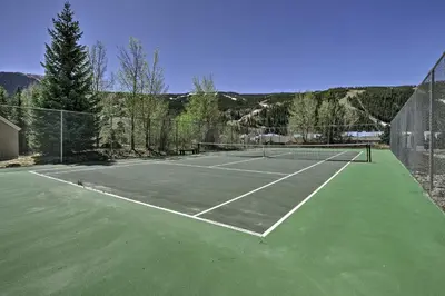 a tennis court with two tennis nets on it at Deck and Mtn View Keystone Townhome Near Resort! in Keystone