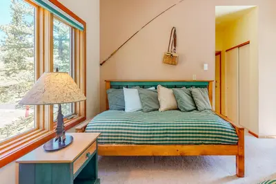 a bedroom with a bed and a lamp on a table at Red Fox in Dillon