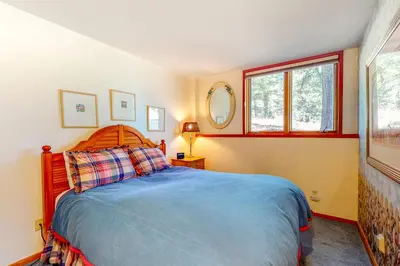 a bedroom with a bed and a window and a mirror at Red Fox in Dillon