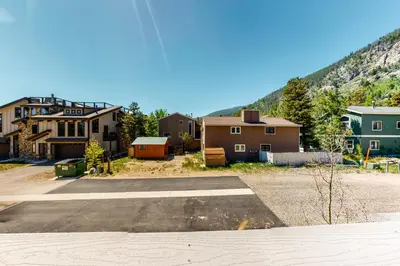 a group of houses with a mountain in the background at Woodhaven Hideaway in Frisco