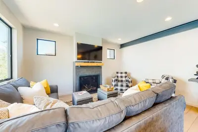 a living room with a couch and a fireplace at Woodhaven Hideaway in Frisco