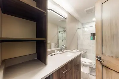 a bathroom with a sink and a toilet at Woodhaven Hideaway in Frisco