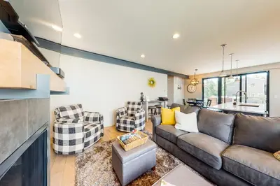 a living room with a couch and two chairs at Woodhaven Hideaway in Frisco