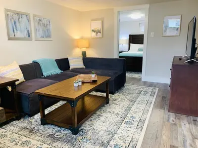 a living room with a couch and a coffee table at Inviting Bungalow Next to UNC - Free Cruiser Bikes in Greeley
