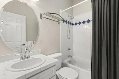 a bathroom with a sink and a toilet and a mirror at Fabulous Family-Friendly Retreat by Windsor Lake! in Windsor