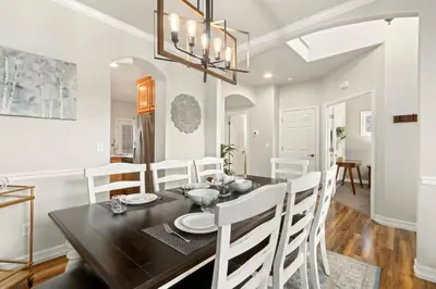 a dining room and living room with a table and chairs at Fabulous Family-Friendly Retreat by Windsor Lake! in Windsor