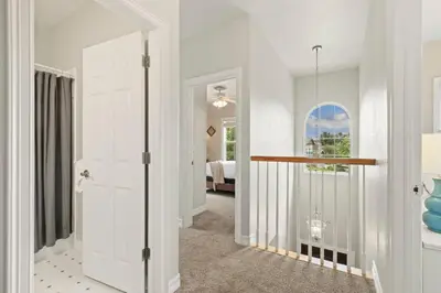 a hallway with a door leading to a bedroom at Fabulous Family-Friendly Retreat by Windsor Lake! in Windsor