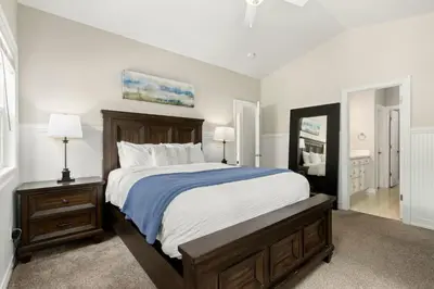 a bedroom with a large bed and a mirror at Fabulous Family-Friendly Retreat by Windsor Lake! in Windsor