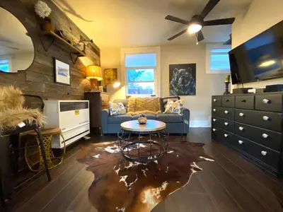 a living room with a couch and a table at The Chic Guest Retreat in Old Town near CSU in Fort Collins