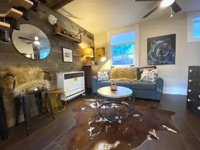 a living room with a couch and a table at The Chic Guest Retreat in Old Town near CSU in Fort Collins